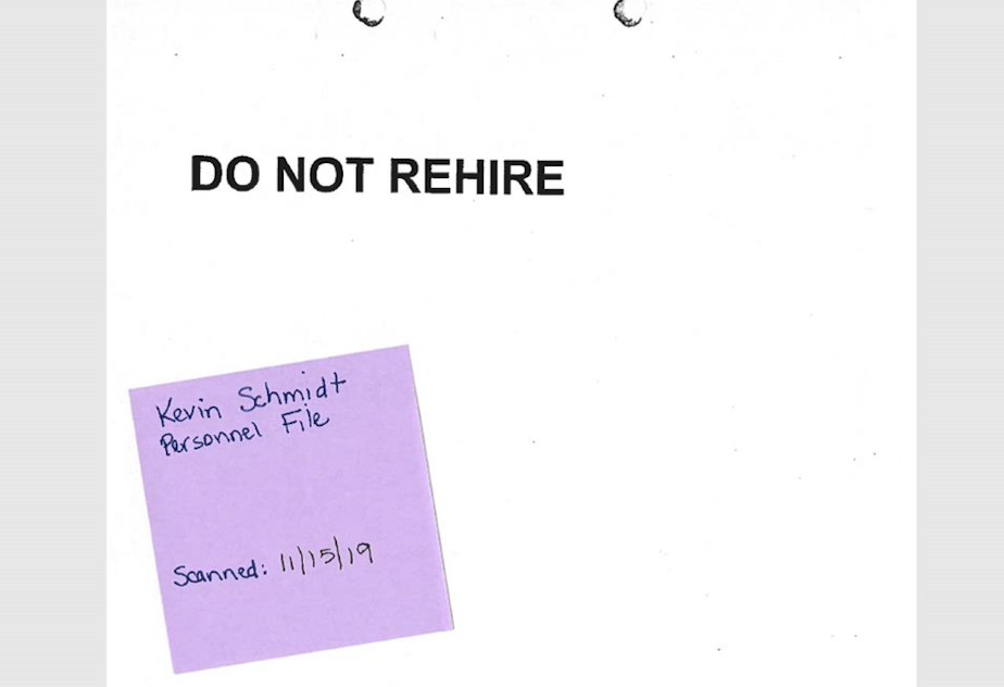 caption: The front of Kevin Schmidt's personnel file at Seattle Public Schools. The sticky note was placed there by district officials.