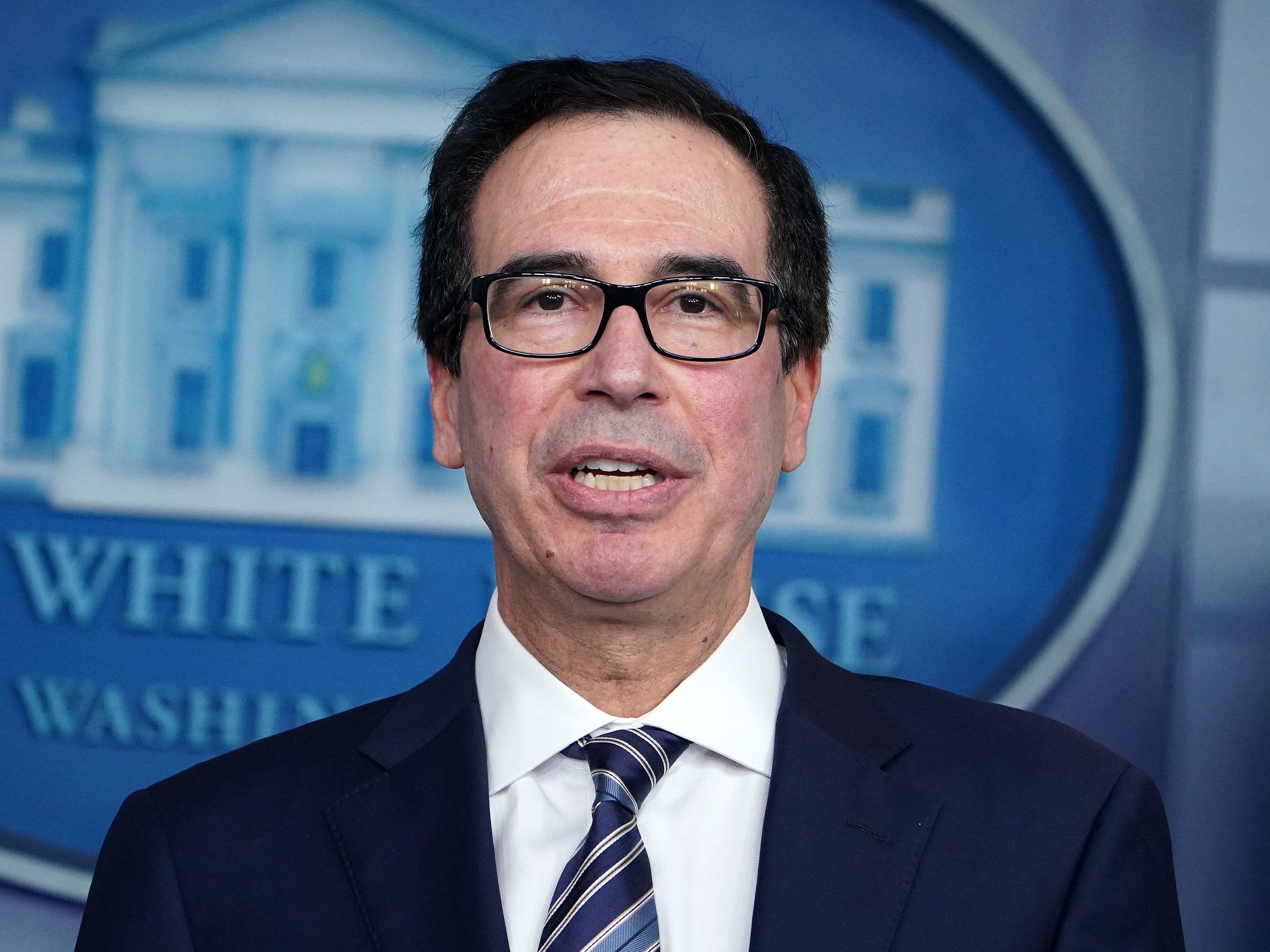caption: Treasury Secretary Steven Mnuchin speaks during the daily coronavirus briefing at the White House on April 2. He negotiated with congressional leaders to increase funding for the small-business loan program.