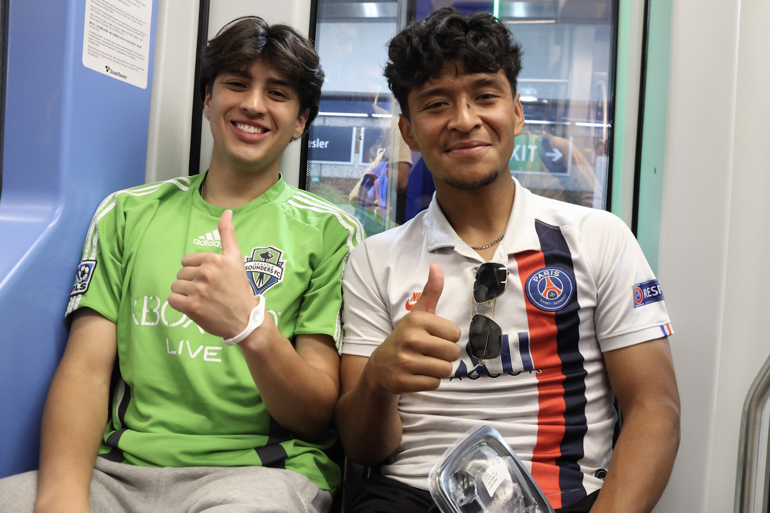 caption: Light rail riders during Seattle's Club World Cup games in 2025.