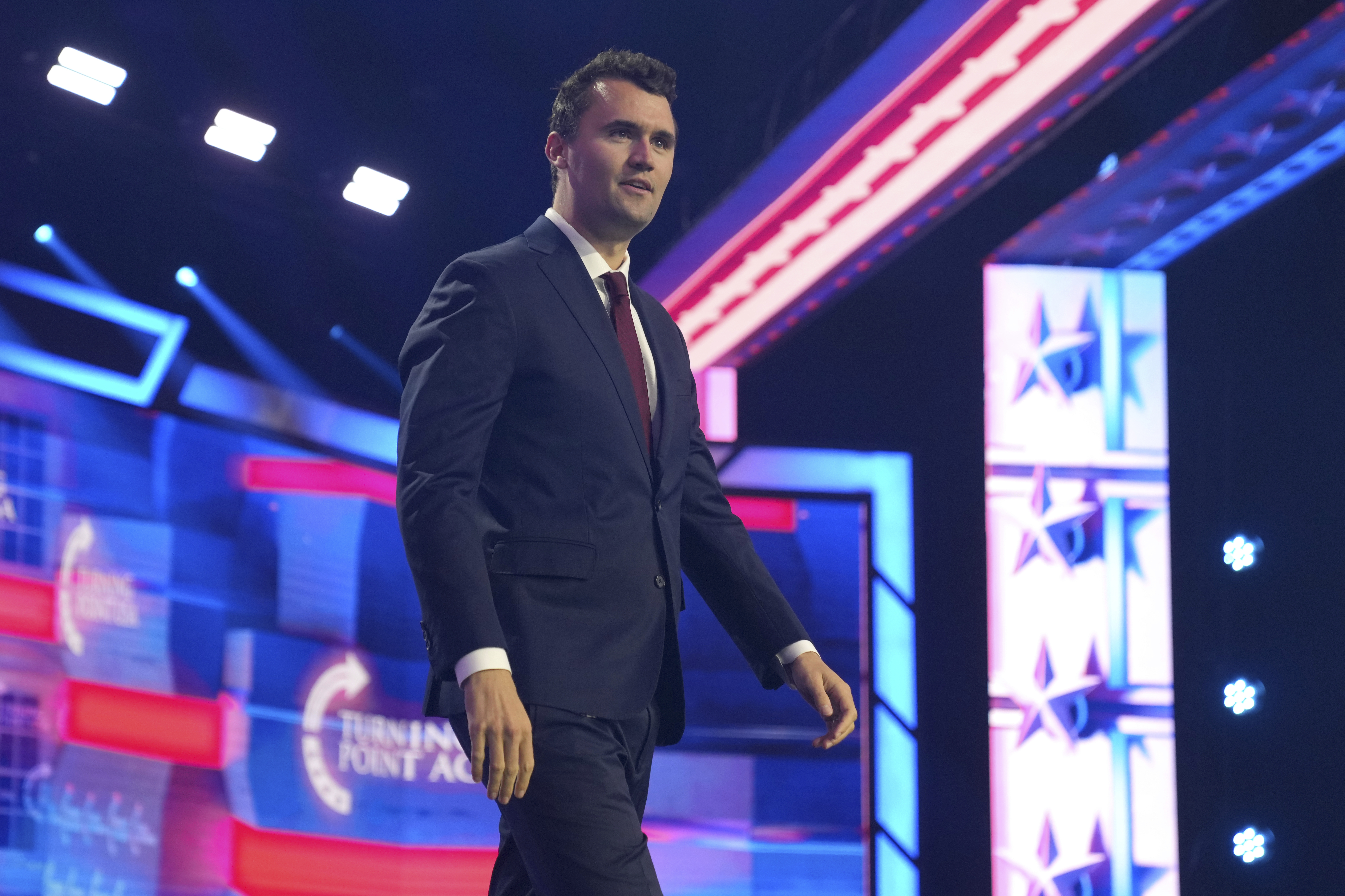 caption: Charlie Kirk speaks at AmericaFest, Sunday, Dec. 22, 2024, in Phoenix. Kirk was fatally shot on Sept. 10, 2025.