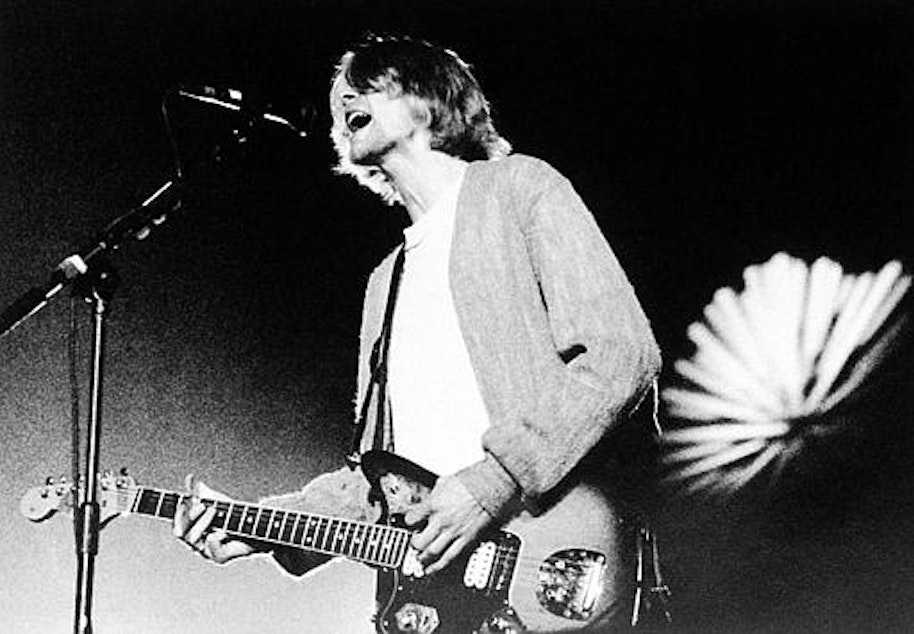 caption: Kurt Cobain is shown during a benefit concert at the Cow Palace in Daly City, Calif., April 9, 1993. 