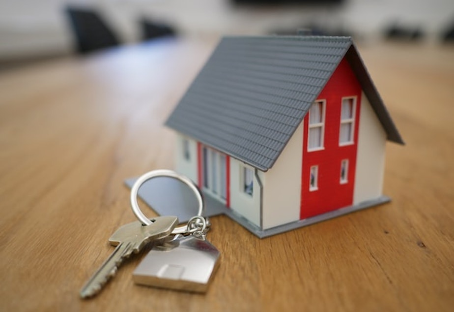 Graphic of a small house and key