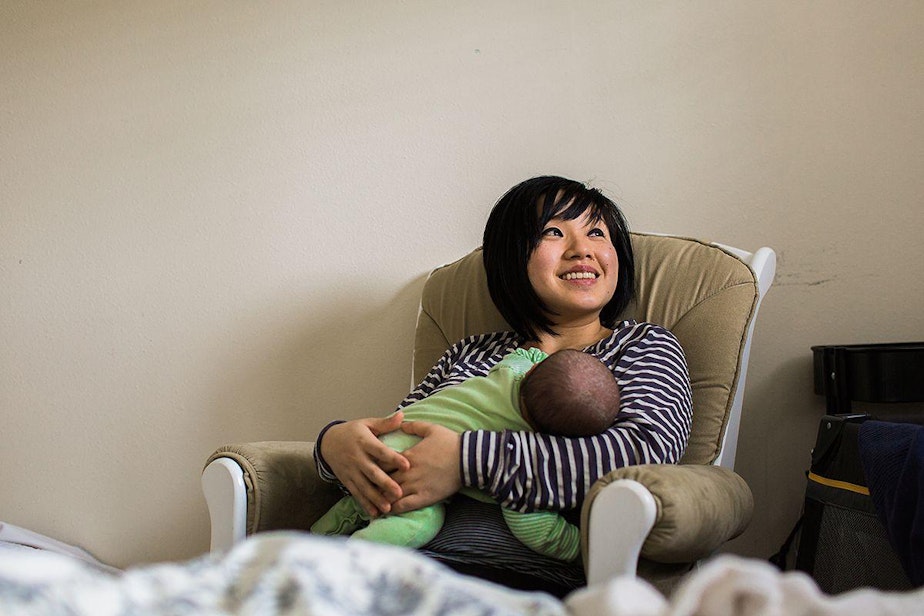 caption: Angela Tam, a Seattle therapist, nurses her newborn daughter, Geneva.