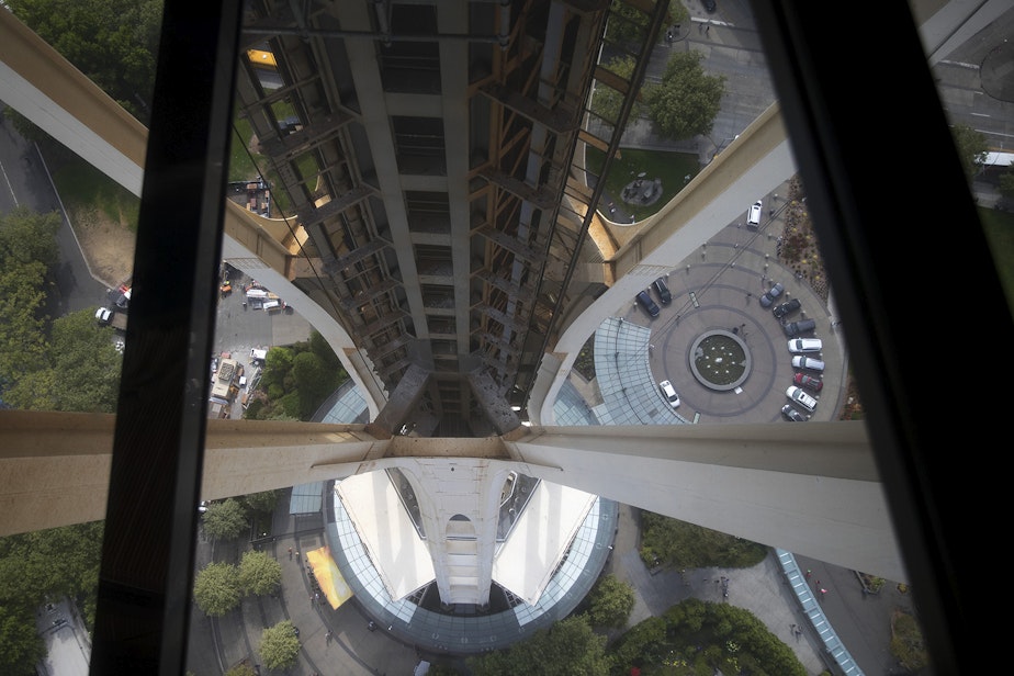 caption: A view from the rotating glass floor at the Space Needle is shown on Friday, August 3, 2018, in Seattle. 