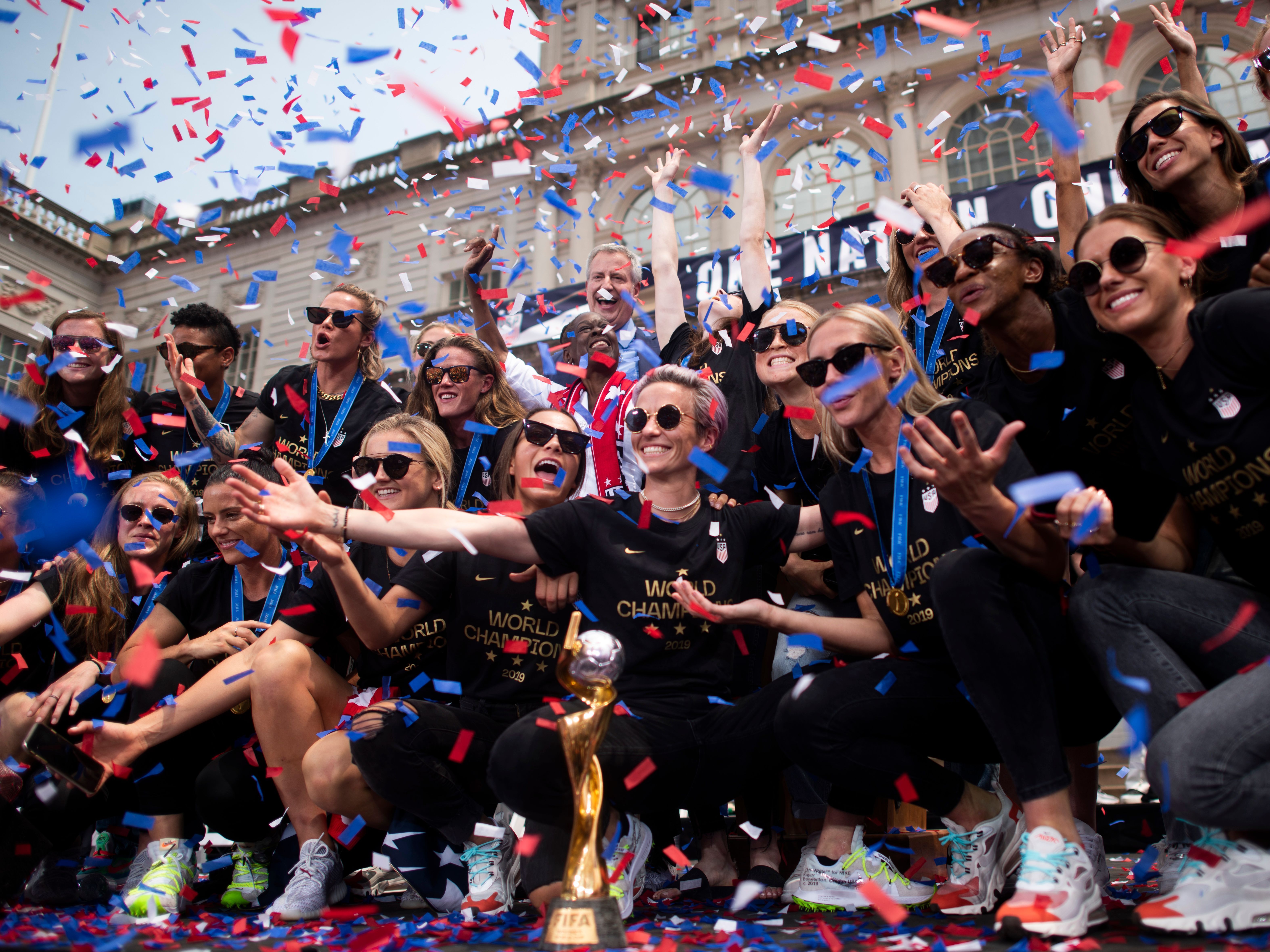 caption: Members of the World Cup-winning U.S. women's team take part in a ticker tape parade for the women's World Cup champions in July 2019 in New York.