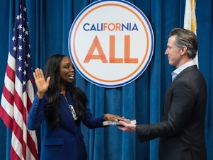 caption: CA.'s first Surgeon General, Dr. Nadine Burke Harris, is sworn in by Gov. Gavin Newsom in February 2019. A leading voice on health care equity, she's helping shape the state's vaccination makeover following a rocky start.