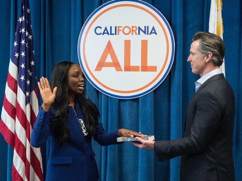 caption: CA.'s first Surgeon General, Dr. Nadine Burke Harris, is sworn in by Gov. Gavin Newsom in February 2019. A leading voice on health care equity, she's helping shape the state's vaccination makeover following a rocky start.