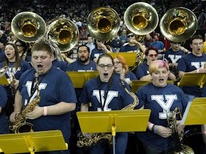 caption: The University of Idaho Marching Band, wearing Yale T-shirts, performs at the NCAA Tournament game between Yale and San Diego State in Spokane, Wash., on Sunday. The band has been honored in Connecticut for filling in as Bulldogs.