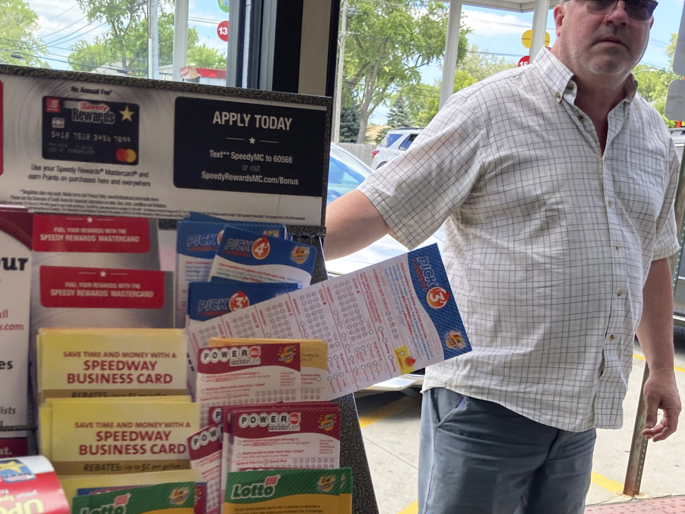 caption: A customer walks in to the Speedway gas station in Des Plaines, Ill., where the winning Mega Millions lottery ticket was sold on July 30. Two people who wish to remain anonymous have claimed the $1.337 billion jackpot, officials said Wednesday.