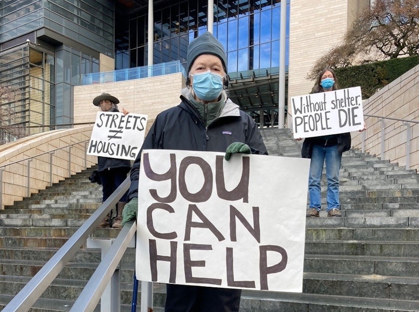 caption: Jean Darsie outside Seattle City Hall during the pandemic.