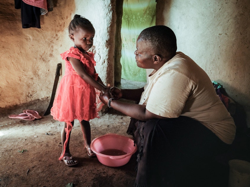 caption: Isabela Oside, 45, washes hands of her daughter Faith, 3, who completed doses through the worlds first malaria vaccine. Malaria is one of the preventable diseases that contributes to worldwide child mortality.