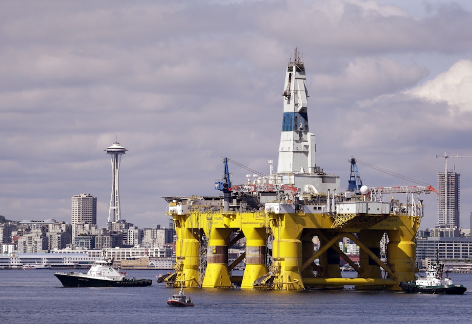 caption: The drilling rig Polar Pioneer outfitting for arctic oil exploration in 2015. A proposed rule from the Trump administration would force banks to offer financing to oil companies, gun-makers, and high-cost payday lenders, even if the banks don't want to do that.