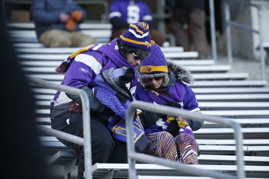 caption: Minnesota Vikings fans sit ithe stands after an NFL wild-card football game against the Seattle Seahawks, Sunday, Jan. 10, 2016, in Minneapolis. The Seahawks won 10-9.