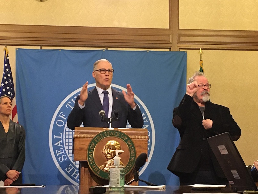 caption: Washington Gov. Jay Inslee speaks at a news conference on Tuesday during which he announced new restrictions on long-term care facilities to address the growing coronavirus epidemic in the state.