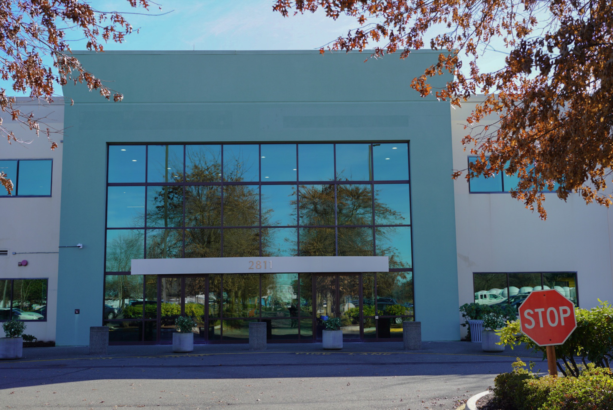 caption: The front entrance of a new potential Tukwila office of Immigration and Customs Enforcement shown on Feb. 11, 2025.