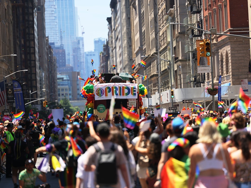 caption: People participate in the New York City Pride Parade on Fifth Avenue in New York on June 26, 2022.