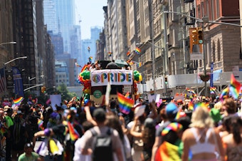 caption: People participate in the New York City Pride Parade on Fifth Avenue in New York on June 26, 2022.