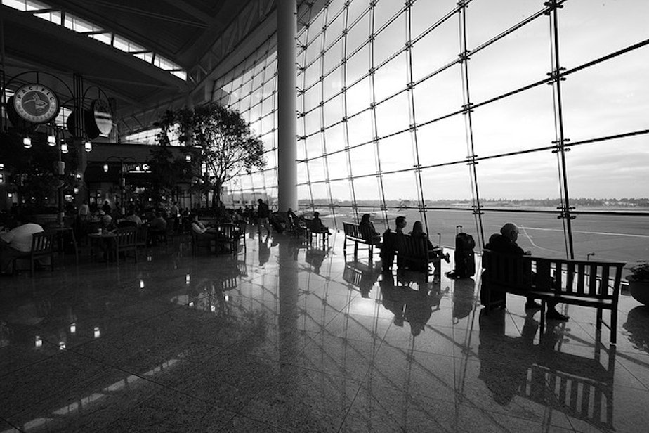 caption: The food court at Sea-Tac International Airport looks out on runway.