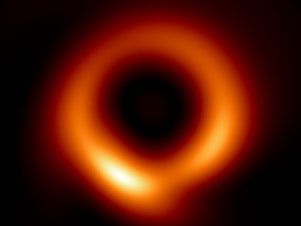 caption: Researchers used computer simulations of black holes and machine learning to generate a revised version (right) of the famous first image of a black hole that was released back in 2019 (left).