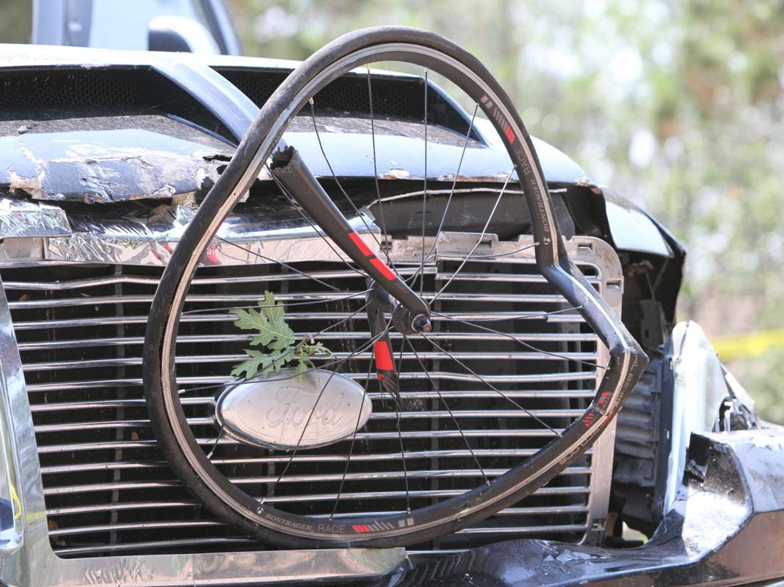 caption: Police say a driver in a pickup truck plowed into bicyclists competing in a community road race in Arizona, critically injuring several riders. Authorities say officers then chased down the driver Saturday and shot him outside a nearby hardware store.