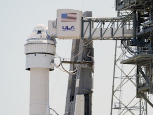 caption: Boeing's Starliner capsule atop an Atlas V rocket is seen at Space Launch Complex 41 at the Cape Canaveral Space Force Station on May 7, a day after its mission to the International Space Station was scrubbed because of an issue with a pressure regulation valve.