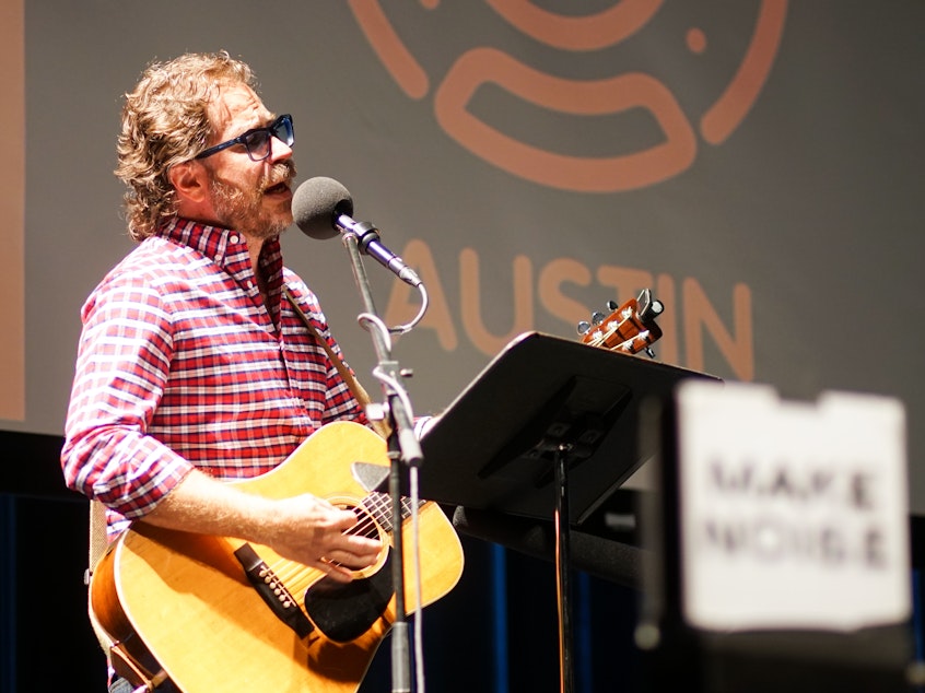 caption: <em>Ask Me Another</em>'s house musician Jonathan Coulton leads a music parody game at Cullen Performance Hall at the University of Houston, in Houston, Texas.