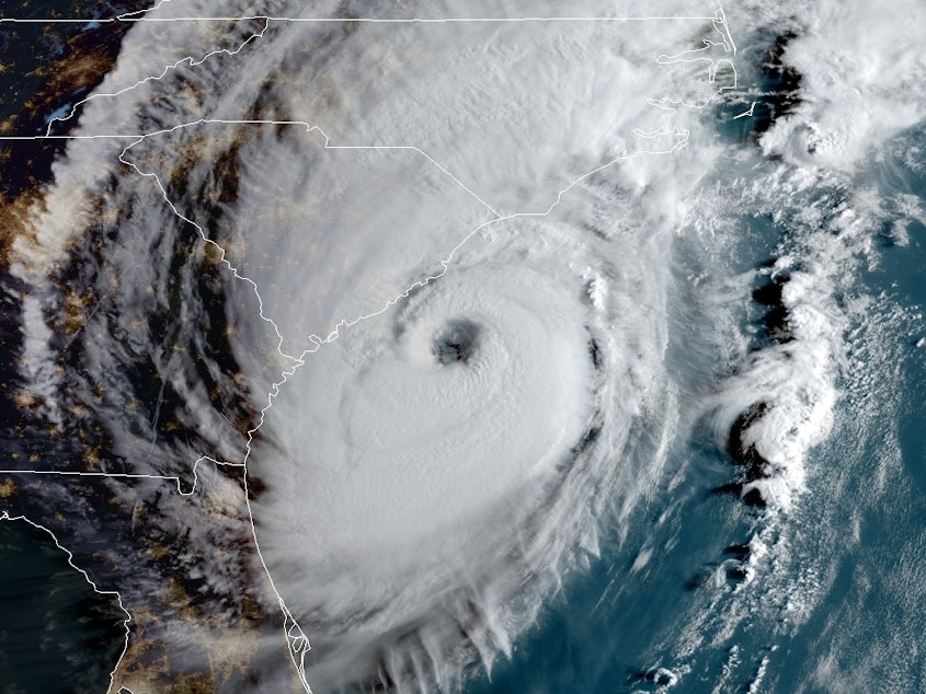 caption: Hurricane Dorian is edging close to the southeastern coast, bringing dangerous flooding to South Carolina. The storm is seen here at 8 a.m. ET Thursday.