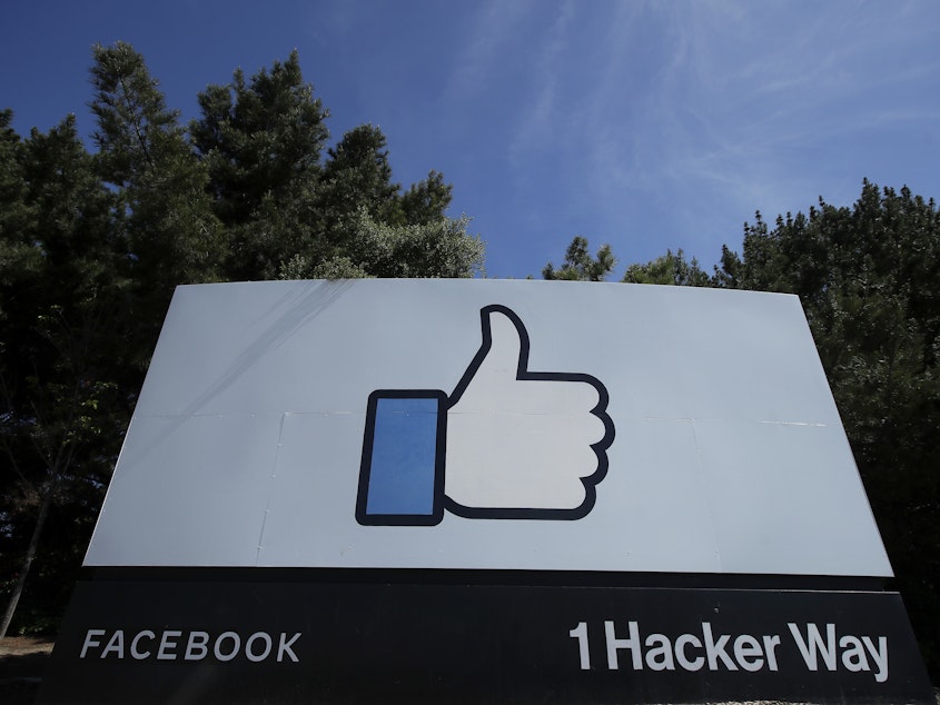 caption: Facebook's Like logo is shown on a sign at the company's headquarters in Menlo Park, Calif.