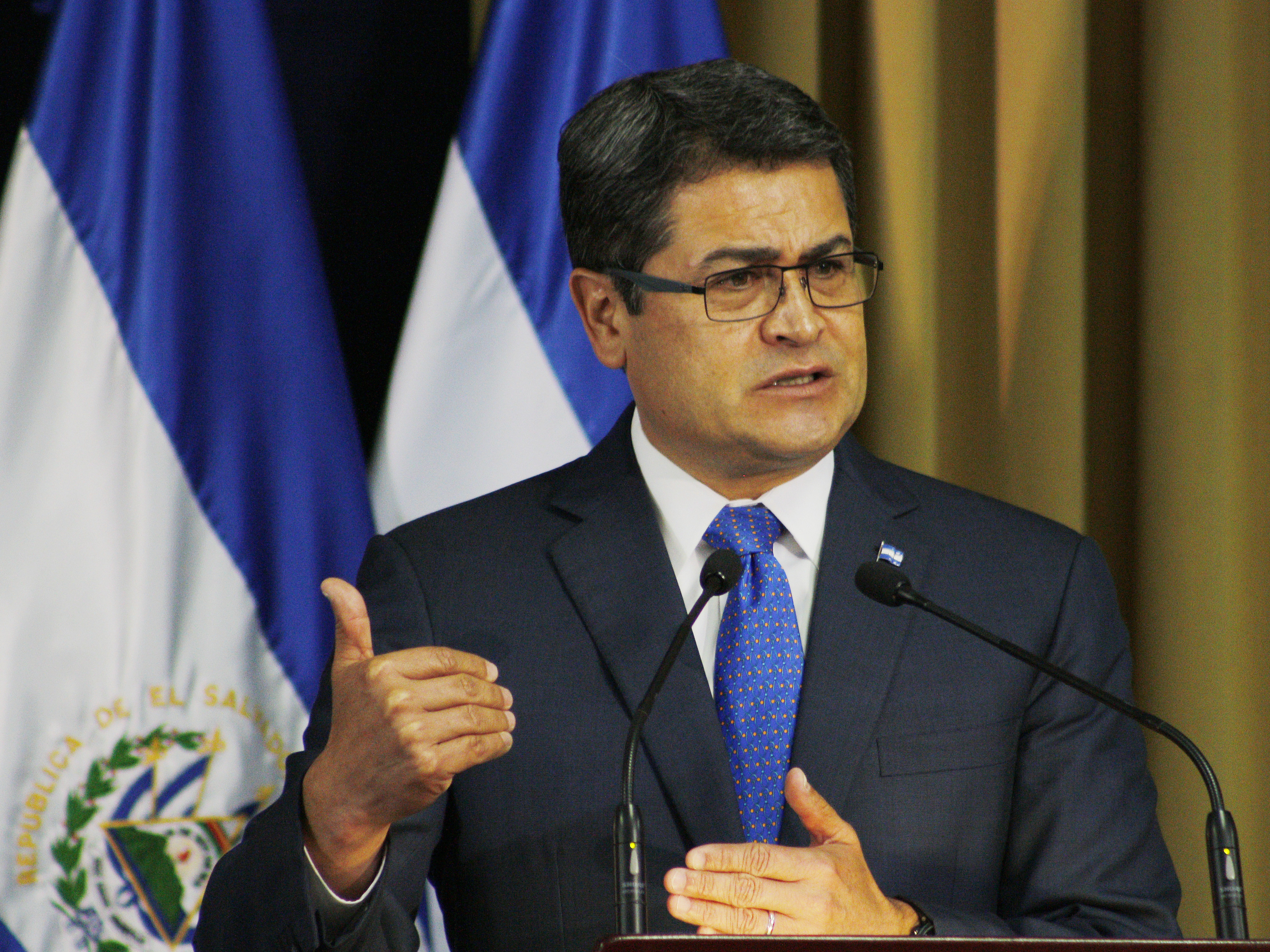 caption: Then-Honduran President Juan Orlando Hernandez gives an speech in San Salvador, El Salvador.