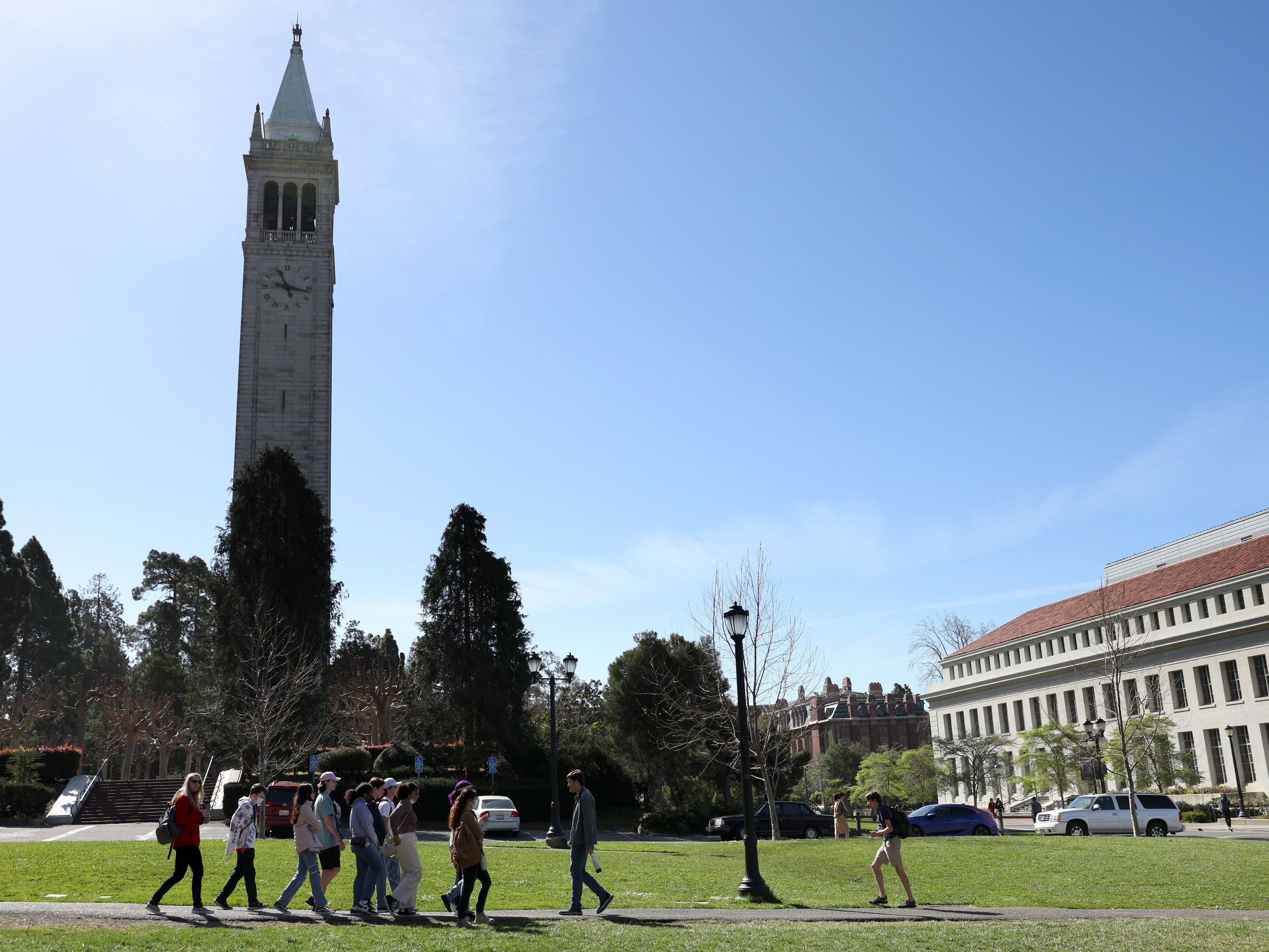 caption: A group walks on the UC Berkeley campus on March 14, 2022, in Berkeley, Calif. California led the U.S. in international enrollment, with over 140,000 international students attending schools there in the 2023-24 academic year, according to the Institute of International Education.