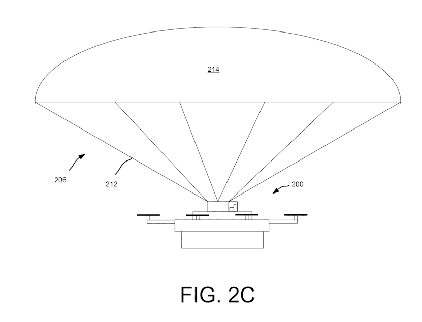 caption: An Amazon drone descends by parachute in yet an Amazon patent