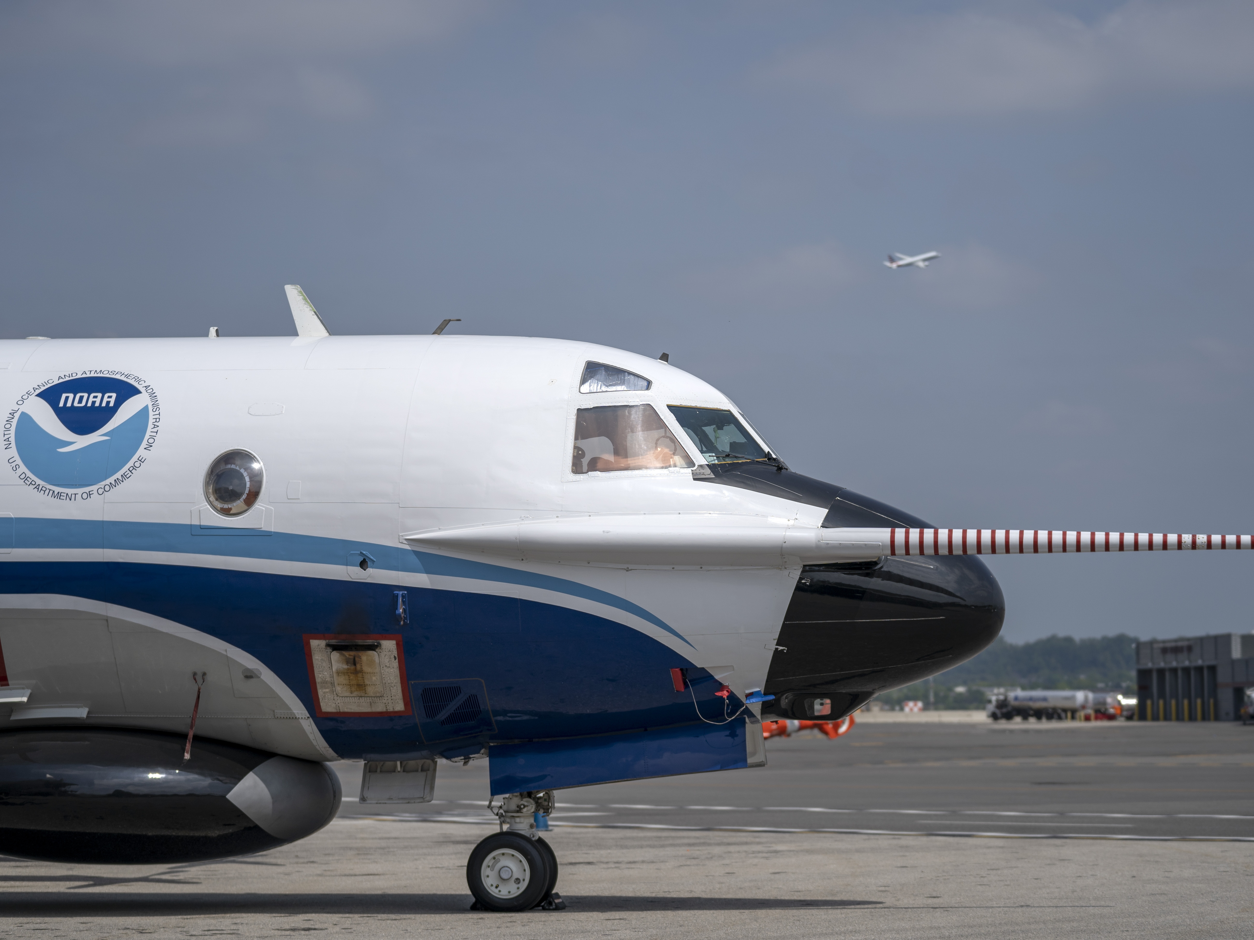 caption: The National Oceanic and Atmospheric Administration's Orion hurricane hunter aircraft sits on the tarmac at Ronald Reagan Washington National Airport in 2022. Data gathered by the aircraft helps federal scientists issue hurricane warnings to the public.