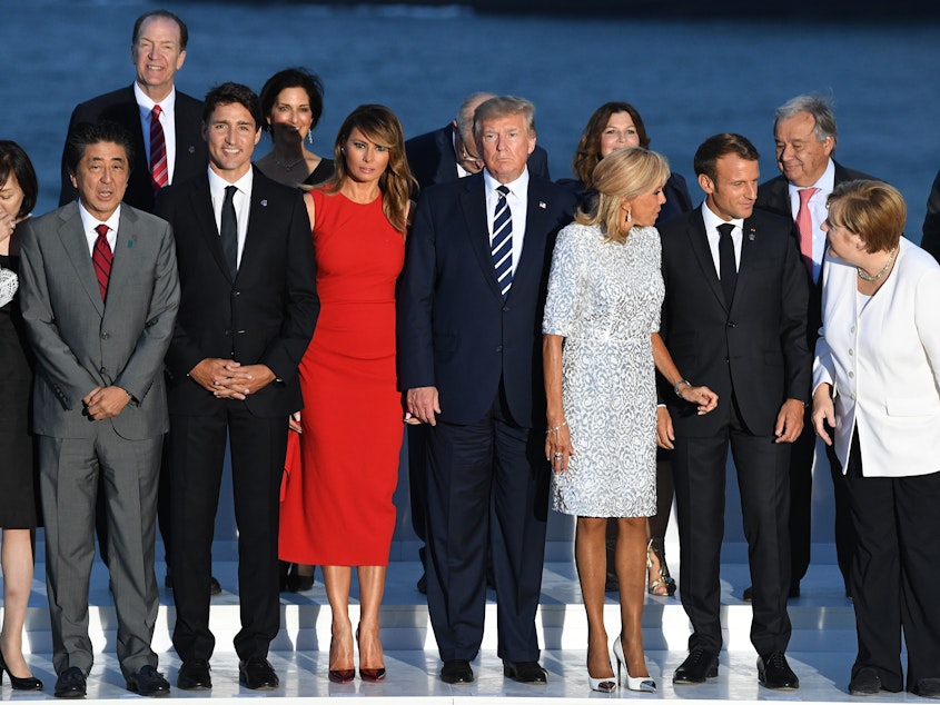 caption: World leaders gather for a group photo at the G-7 summit in Biarritz, France, on Sunday. Summit host and French President Emmanuel Macron and President Trump are holding a joint press conference on Monday.