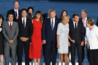 caption: World leaders gather for a group photo at the G-7 summit in Biarritz, France, on Sunday. Summit host and French President Emmanuel Macron and President Trump are holding a joint press conference on Monday.