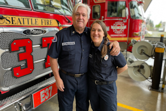 caption: Seattle Fire Captain Gordon Wolcott and his daughter Raechel Ehlers. They are the Seattle FIre Department's first father-daughter firefighting duo. 