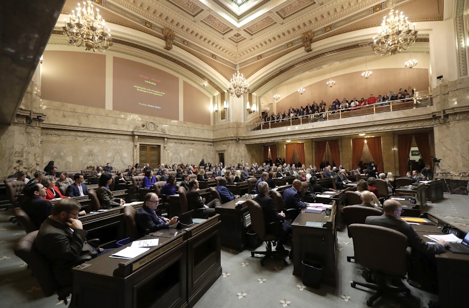 caption: Washington House representatives listen to testimony, Thursday, Jan. 24, 2019, before they unanimously voted to approve a code of conduct for the Legislature in Olympia, Wash.