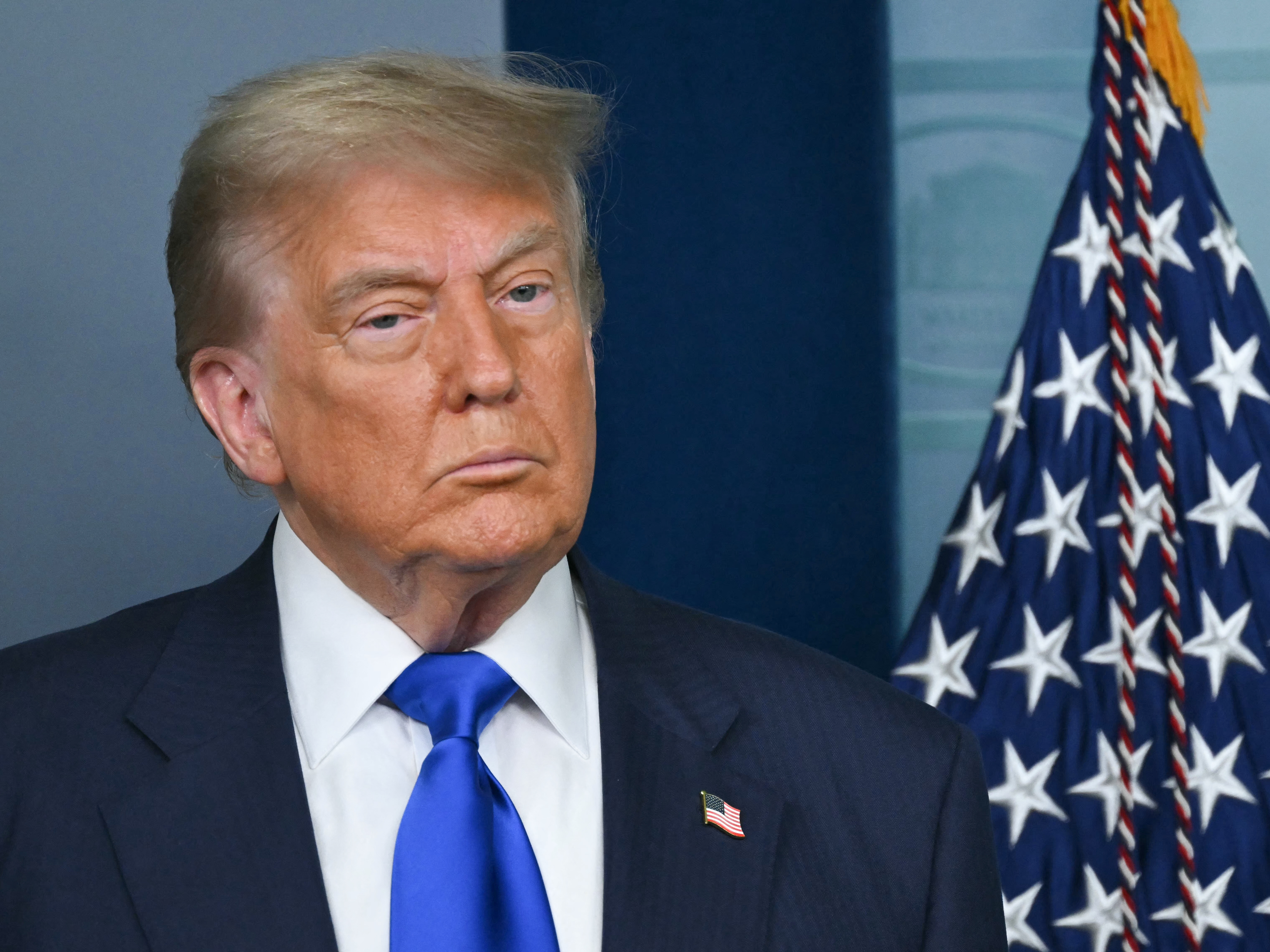caption: President Trump looks on during a news conference in the Brady Briefing Room of the White House on June 27, 2025, in Washington, DC. Trump claimed a "GIANT WIN" on his social media platfom on Friday after the Supreme Court curbed the power of lone federal judges to block executive actions.