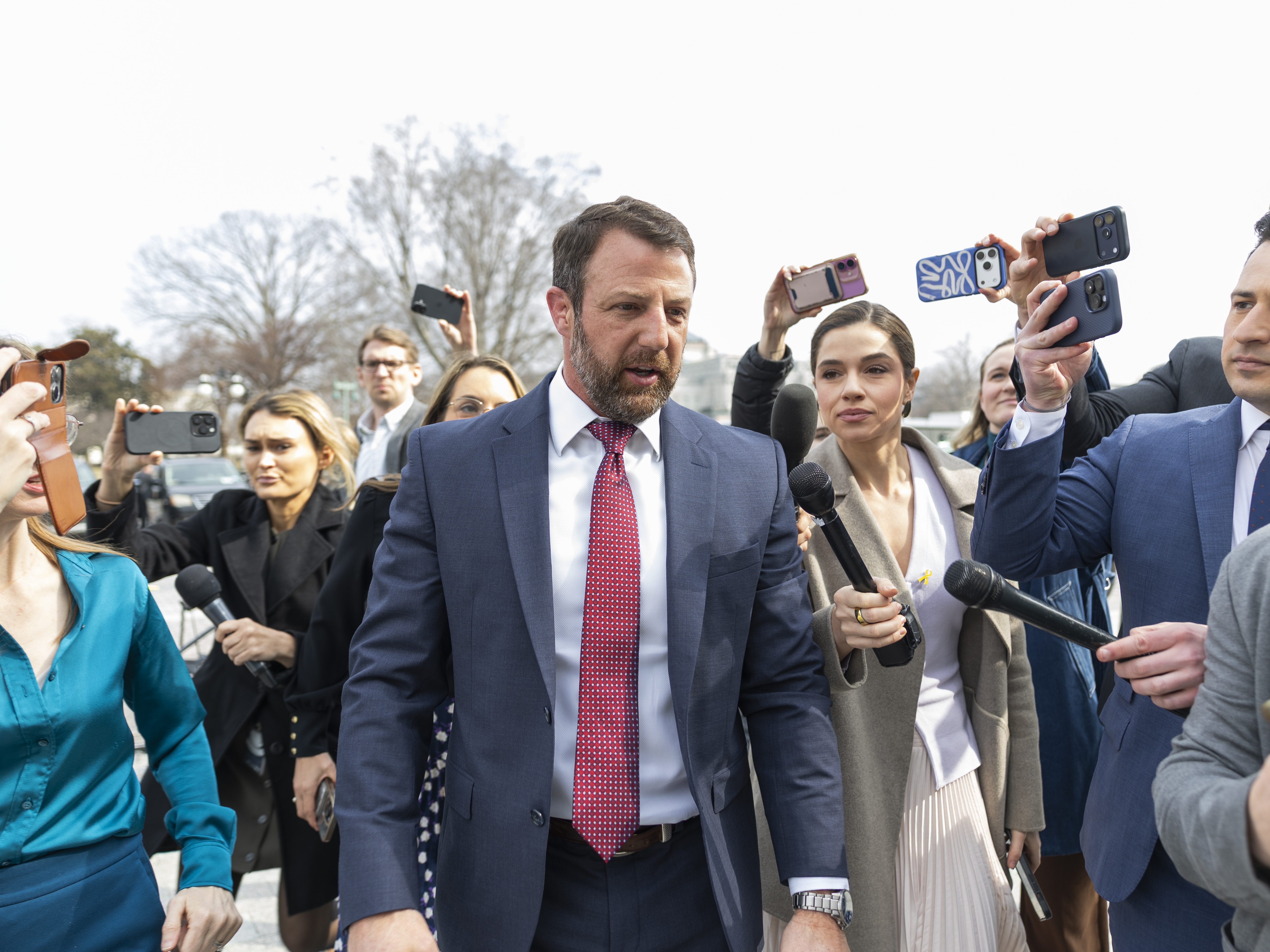 caption: Sen. Markwayne Mullin, R-Okla. spoke with reporters at the Capitol on Thursday. President Trump announced that Mullin is his pick to replace Kristi Noem as the head of the Department of Homeland Security.