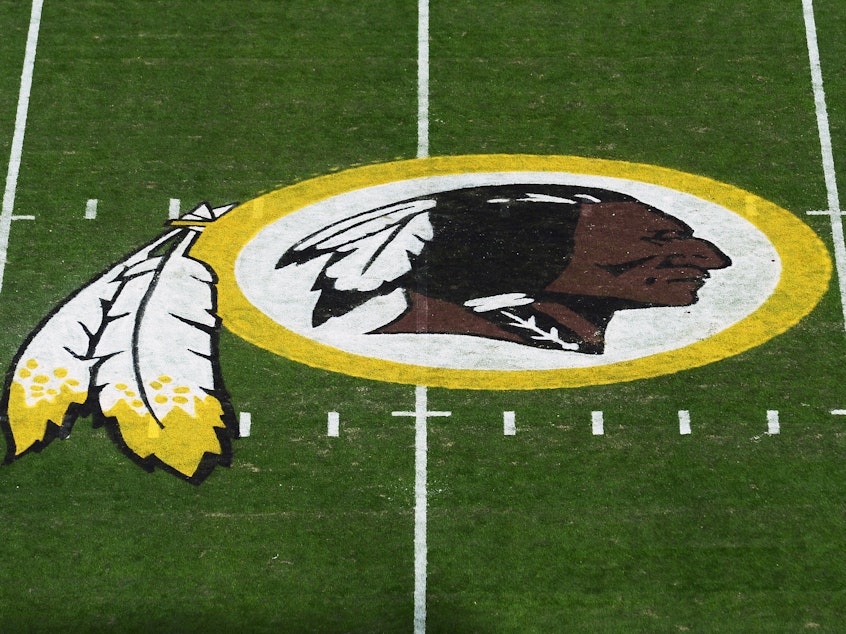 caption: A view of the Washington Redskins logo at center field before a game between the Detroit Lions and Redskins at FedExField on November 2019 in Landover, Maryland.