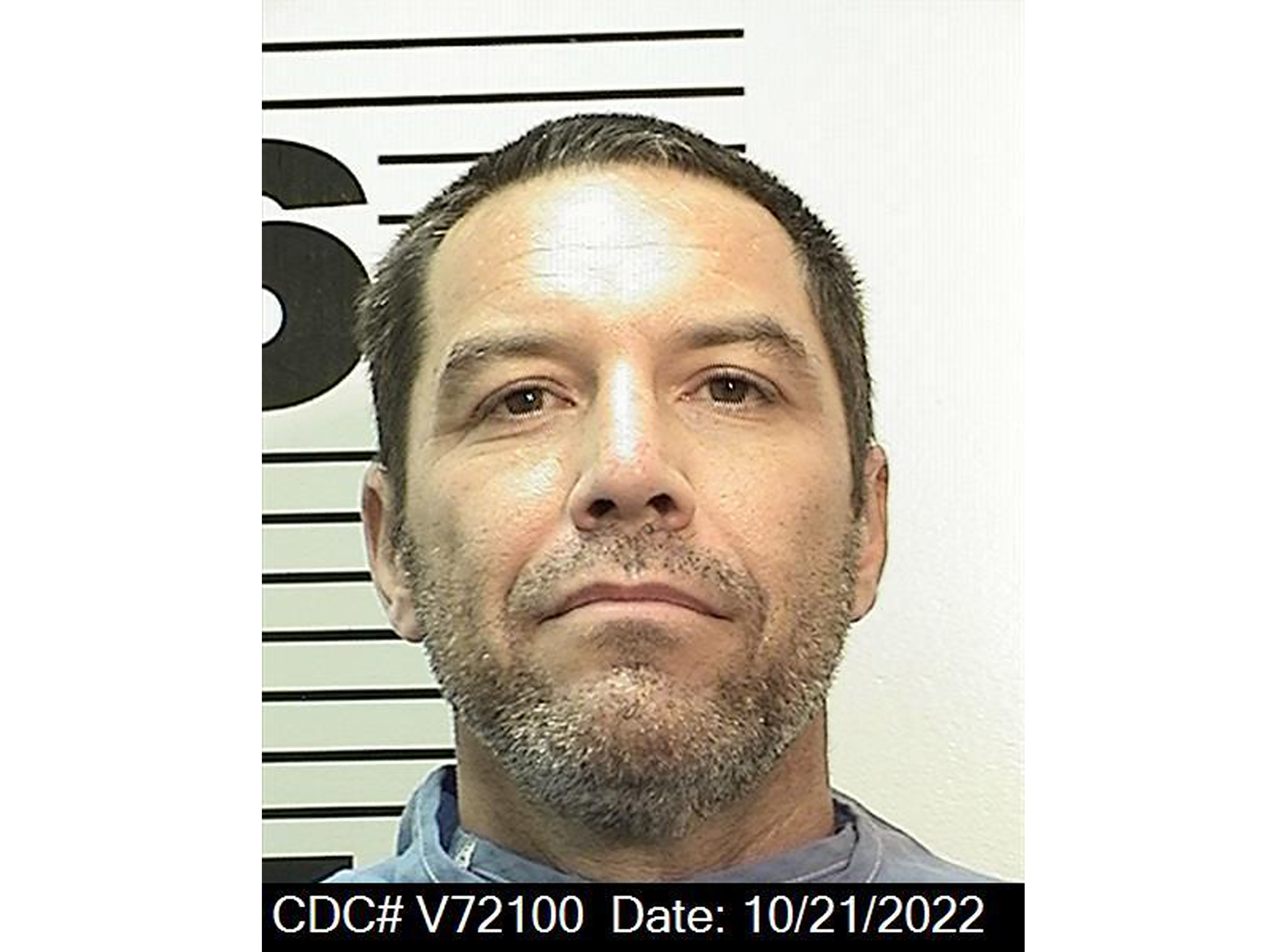 caption: A new mug shot taken Friday shows Scott Peterson, 50, with salt-and-pepper stubble compared to his previous clean-shaven look.