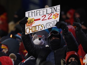 caption: A Kansas City Chiefs fan holds a sign during the AFC Wild Card Playoffs between the Miami Dolphins and the Chiefs on Saturday in Kansas City, Mo.