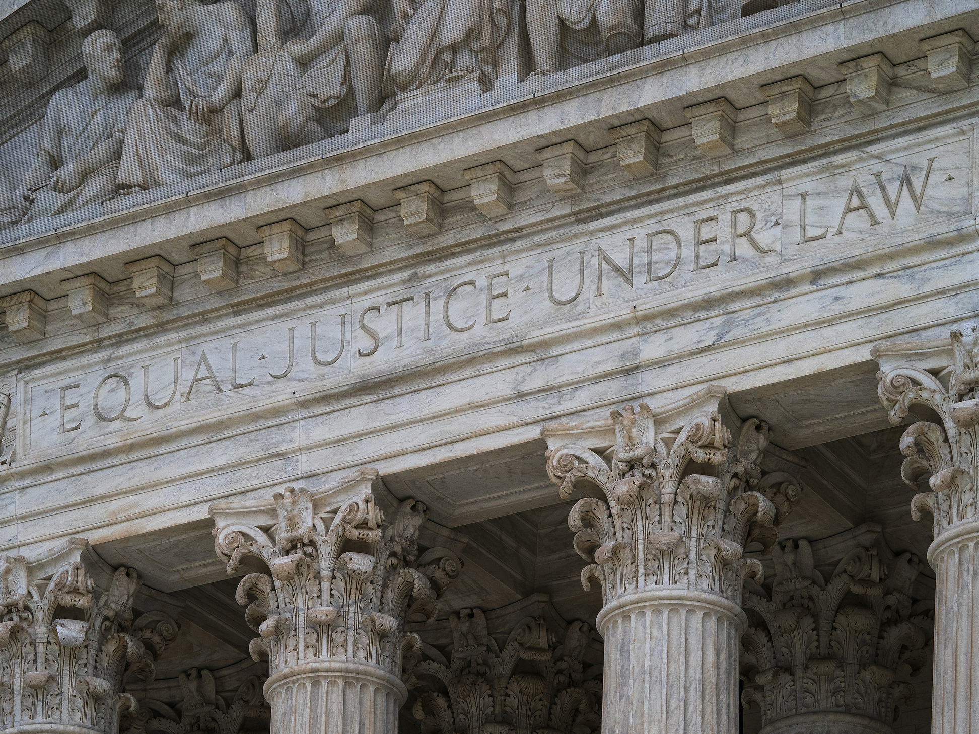 caption: The motto "Equal Justice Under Law" adorns the Supreme Court building in Washington. A new scholars program named for the first Black justice, Thurgood Marshall, and the first Black woman to serve as a federal judge, Constance Baker Motley, aims to cultivate the next generation of civil rights lawyers.