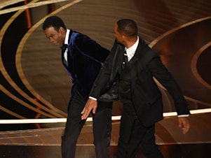 caption: Actor Will Smith (R) slaps comedian Chris Rock onstage during the 94th Oscars at the Dolby Theatre in Hollywood, California on Sunday.