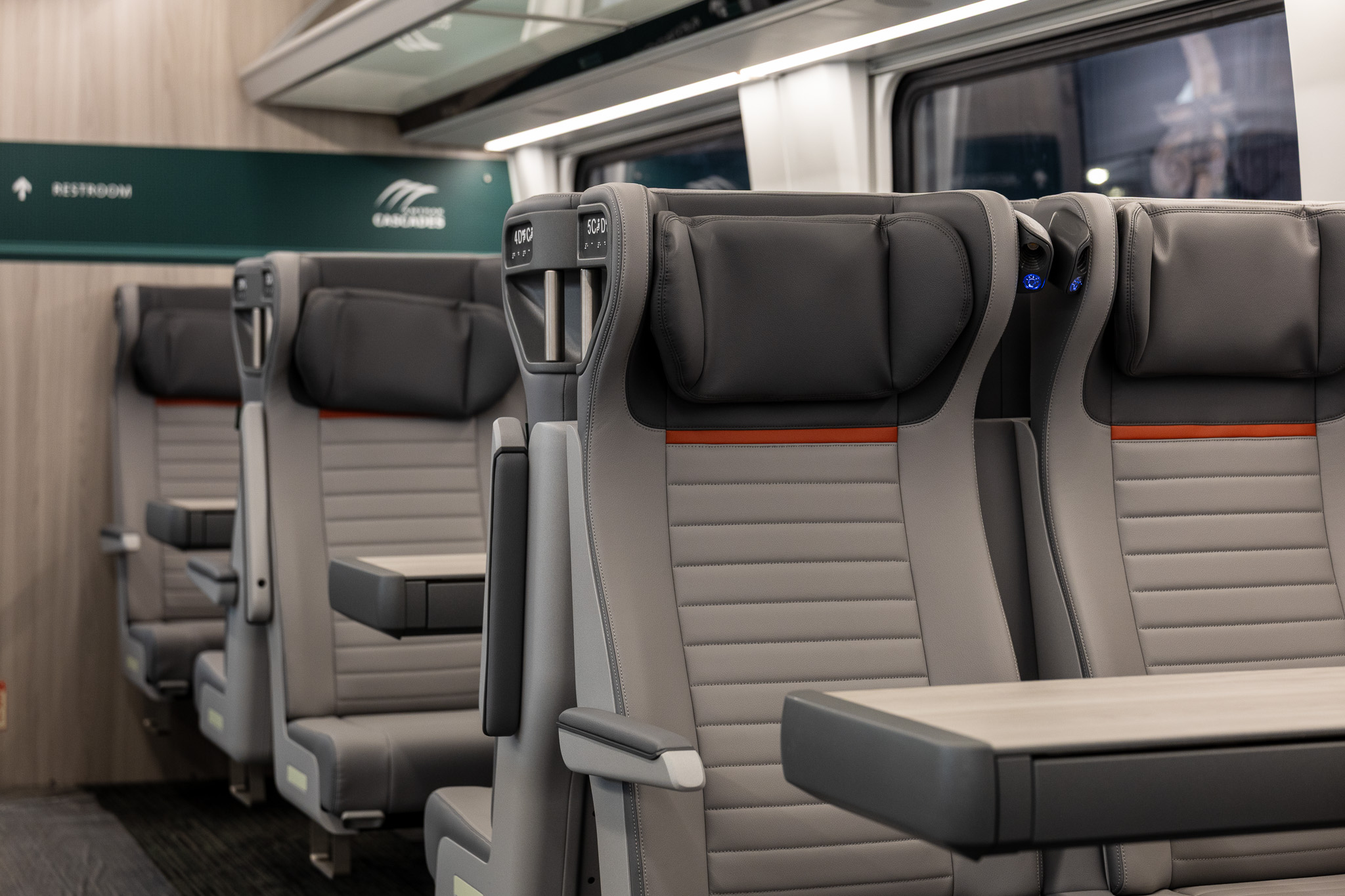 caption: Amtrak’s new Airo trains feature modern interiors with ergonomic seats, USB ports, faster Wi-Fi, cup holders and sturdier tray tables.