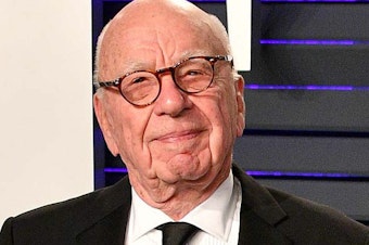 caption: Rupert Murdoch, 92, is stepping down as chair of his global media empire, which includes Fox News and <em>The Wall Street Journal</em>.