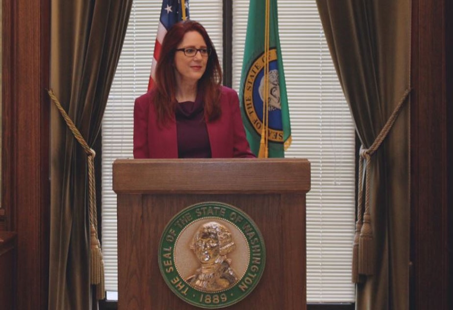 caption: Washington Secretary of State Kim Wyman at the state capitol in Olympia in 2017. 