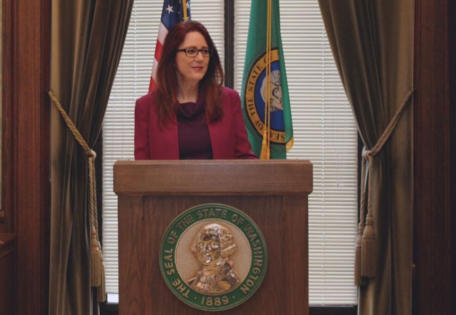 caption: Washington Secretary of State Kim Wyman at the state capitol in Olympia in 2017. 