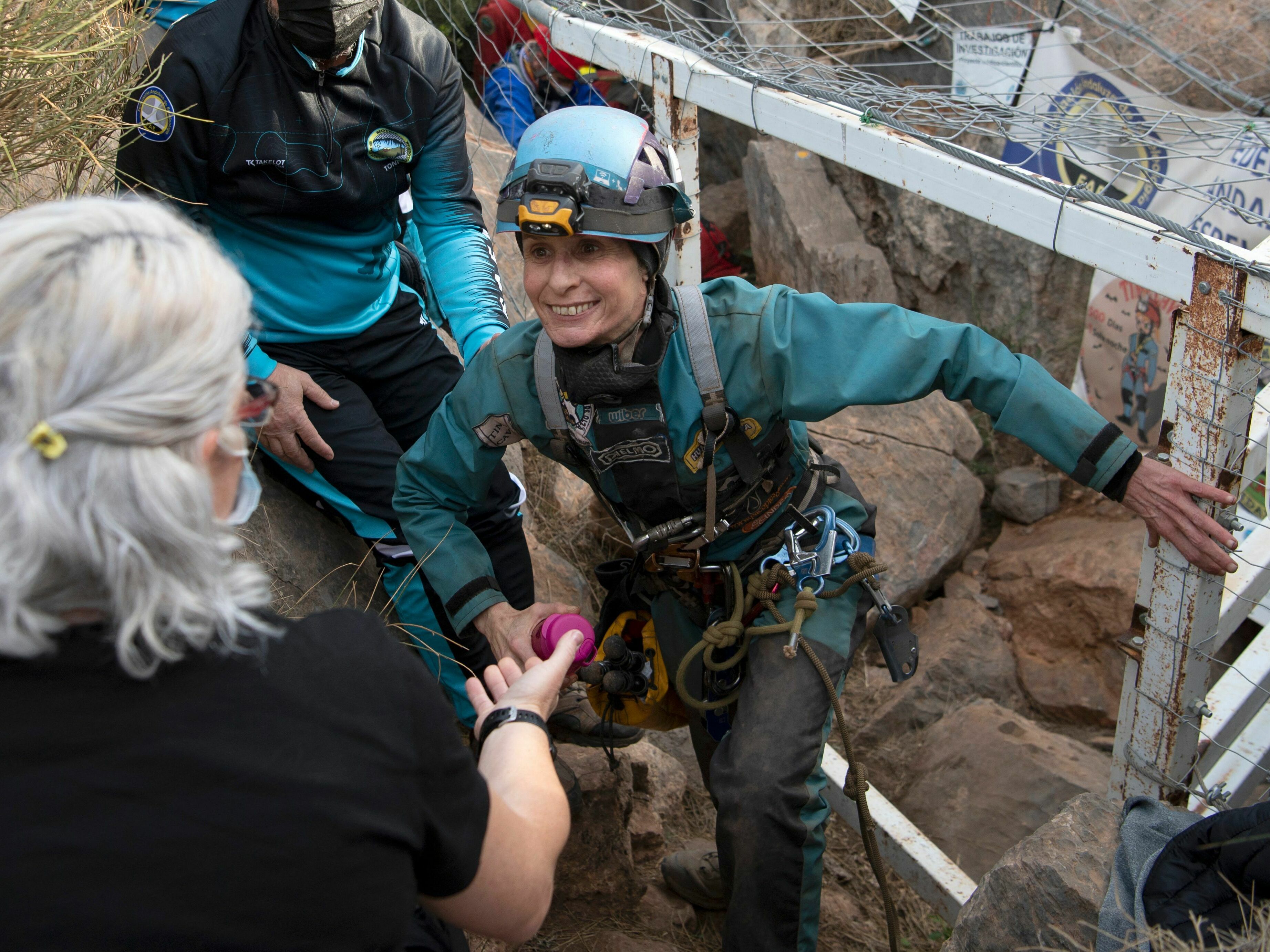 caption: Beatriz Flamini leaves a cave in Los Gauchos, near the Spanish town of Motril on Friday.