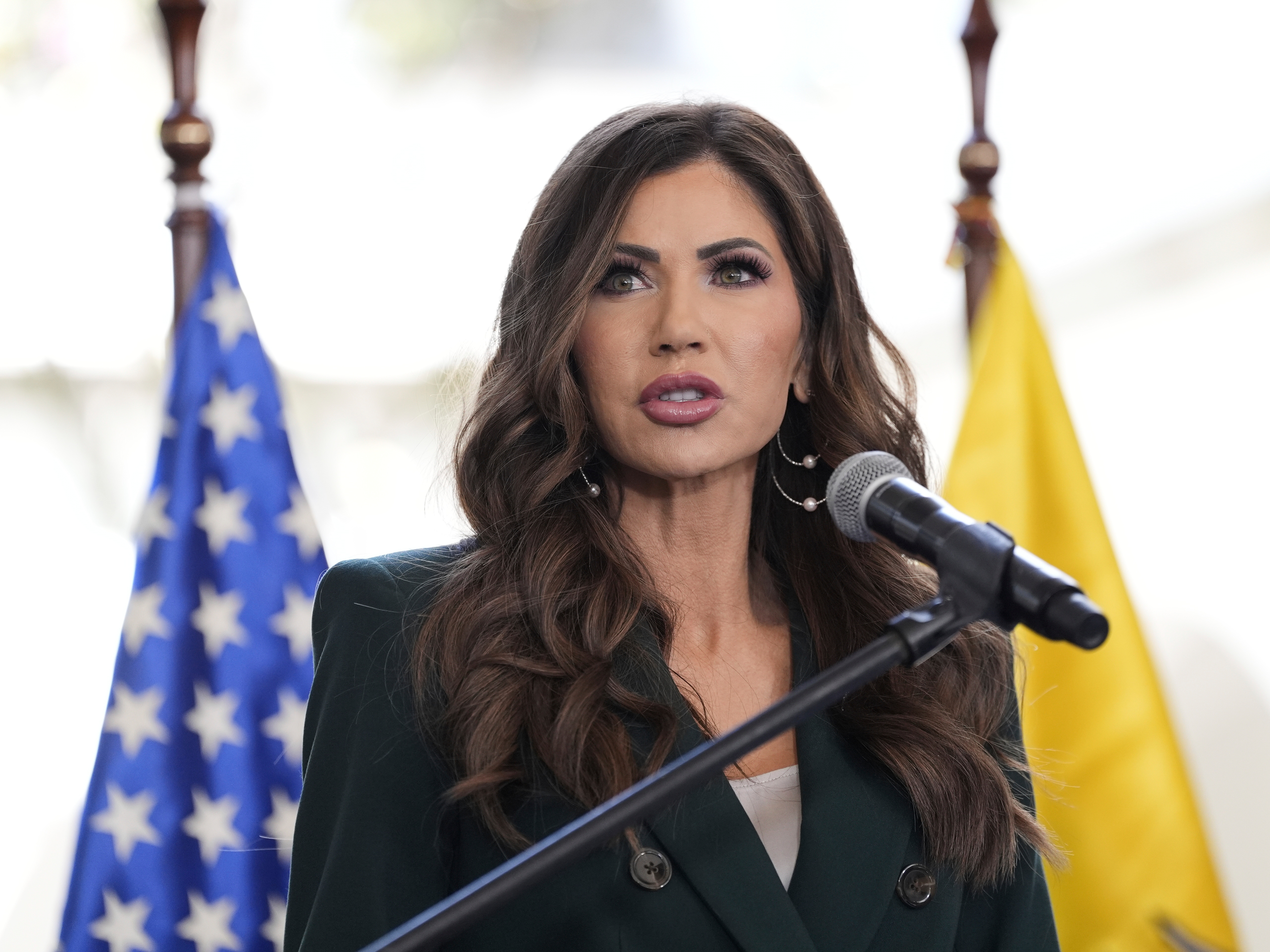 caption: U.S. Homeland Security Secretary Kristi Noem speaks during a press briefing at the Ecuadorian Presidential Palace on July 31, 2025, in Quito, Ecuador.