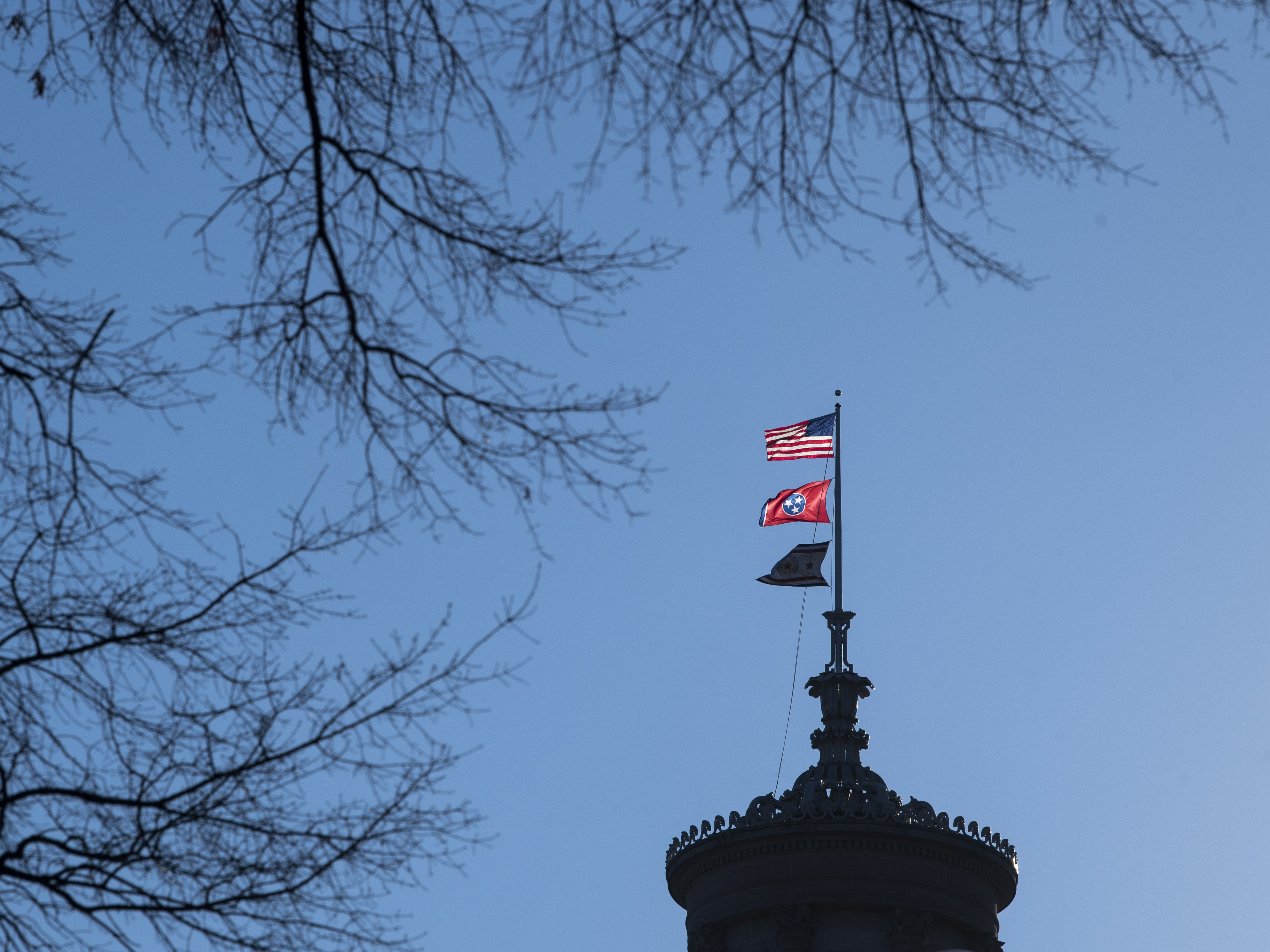 caption: Flags fly over the state capitol, Friday, Feb.11, 2022, in Nashville, Tenn. Republican lawmakers there are working to restrict drag shows in the state.